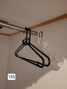 a light hanging from the ceiling of a room at 小浜島 135号棟 in Kohama
