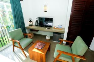 Un televizor și/sau centru de divertisment la Riviera Tide