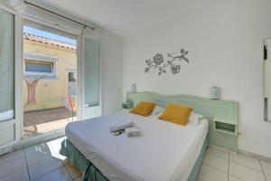 Postel nebo postele na pokoji v ubytování Hotel Camille