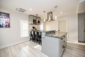 a kitchen with white walls and a counter top at Luxurious room in Fall River Stay in Fall River