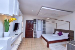 Postel nebo postele na pokoji v ubytování Diani Cosy Studio + 21 fotografií
