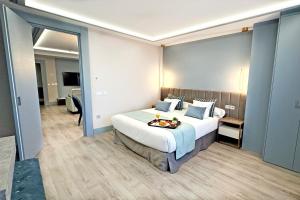 Postel nebo postele na pokoji v ubytování Hotel Alfonso VIII