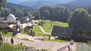 a group of people riding on a horse in a village at Apartmán TATRAN Jarka in Donovaly