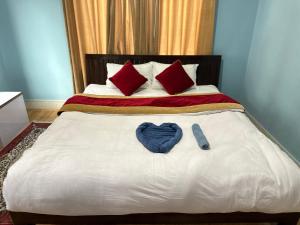 Postel nebo postele na pokoji v ubytování PS Boutique Hotel