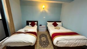 Postel nebo postele na pokoji v ubytování PS Boutique Hotel