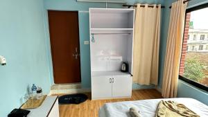 Postel nebo postele na pokoji v ubytování PS Boutique Hotel