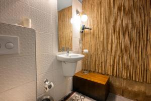 a bathroom with a sink and a toilet and a mirror at Delight Deluxe Port in Antalya +89 photos