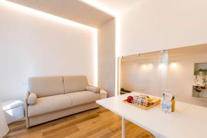 a living room with a couch and a table at Affittacamere La Nuvola in Chieti
