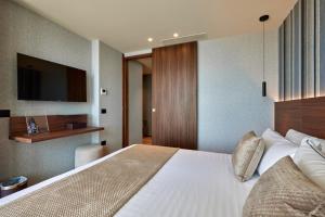 Voodi või voodid majutusasutuse VALIS LUXURY Hotel toas