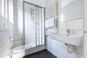 Koupelna v ubytování SMARTY Airport Cologne Hotel - KONTAKTLOSER SELF CHECK-IN