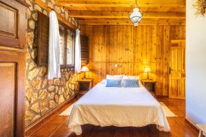 Ένα ή περισσότερα κρεβάτια σε δωμάτιο στο Casa Rural la Laguna