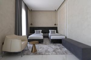 Postel nebo postele na pokoji v ubytování Hotel Plaza Berat