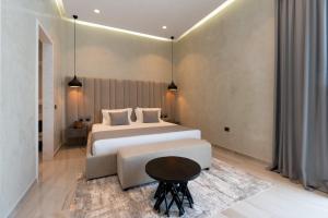 Postel nebo postele na pokoji v ubytování Hotel Plaza Berat