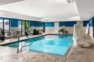 a pool in a hotel with blue walls at Hampton Inn by Hilton Dayton South in Miamisburg