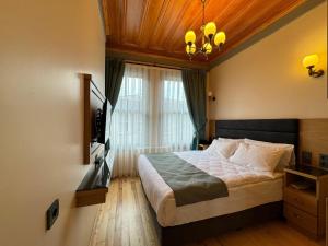 Ένα ή περισσότερα κρεβάτια σε δωμάτιο στο Abelia Mansion Hotel