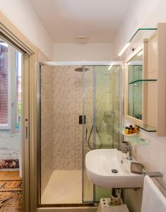 a bathroom with a shower and a sink at Villa Gioietta in Marina di Massa