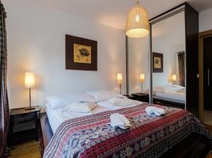 Posteľ alebo postele v izbe v ubytovaní Apartament Egzotyczny Bory