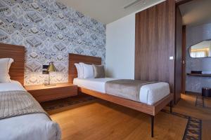 Voodi või voodid majutusasutuse VALIS LUXURY Hotel toas