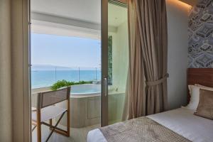 Voodi või voodid majutusasutuse VALIS LUXURY Hotel toas