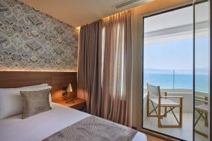 Voodi või voodid majutusasutuse VALIS LUXURY Hotel toas
