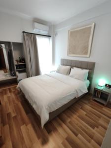 Postel nebo postele na pokoji v ubytování Ulysses Apartments Acropolis
