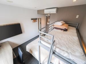 Postel nebo postele na pokoji v ubytování Super Hotel Yokohama Kannai