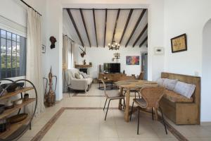 a living room with a table and a couch at Casa Bán in Canillas de Albaida