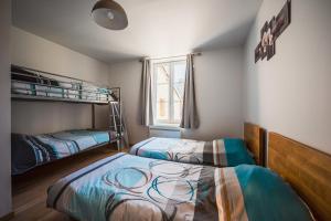a bedroom with two beds and a window at Les gîtes Saint-Aignan in Saint-Aignan +27 photos