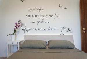 Ένα ή περισσότερα κρεβάτια σε δωμάτιο στο Alloggi Borgo Roma