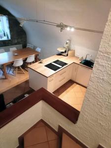 a small kitchen and dining room with a table at La Vigneronne, Chailly-Montreux in Montreux +4 photos