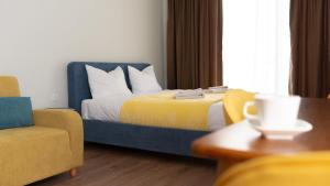 Postel nebo postele na pokoji v ubytování Gudauri Ski Resort - Twins Apartments