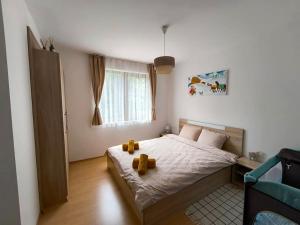 Postel nebo postele na pokoji v ubytování Aпартамент Тити