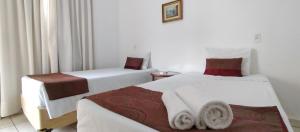 Postel nebo postele na pokoji v ubytování Hotel dos Lagos