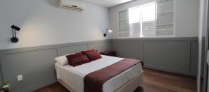 Postel nebo postele na pokoji v ubytování Hotel dos Lagos