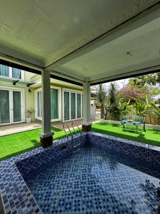 a swimming pool in the backyard of a house at Green Homestay in Nilai
