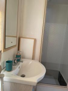 a bathroom with a sink and a shower at Casa vacanze Trinacria in Menfi +39 photos