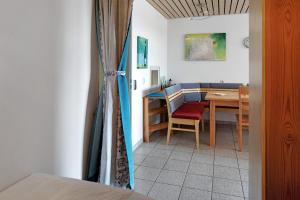 a room with a table and a dining room at Fewo Berggipfel am Feldberg in Feldberg