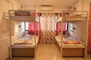 Postel nebo postele na pokoji v ubytování Hostell One - A complete backpacker & Coworking Hub