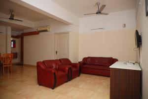 Ein Sitzbereich in der Unterkunft Hotel Tayas, Thiruvananthapuram