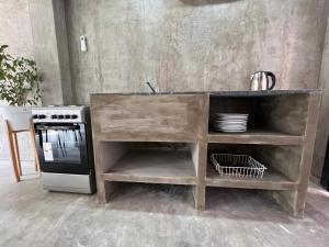 a kitchen with a sink and a stove at DOCTA Residencia in Cordoba +2 photos