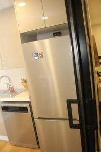 a stainless steel refrigerator in a kitchen at Lovely One Bedroom Appartment-530 in Istanbul +3 photos