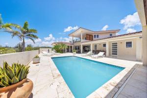 a swimming pool in the backyard of a house at Villa Sol Y Luna - Near Malmok Beach By Lucha in Palm-Eagle Beach