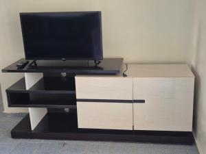 TV a/nebo společenská místnost v ubytování Apartamento de frente para o Mar em Luís Correia