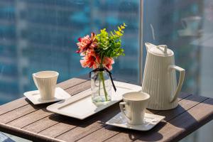 Coffee and tea making facilities at Sleek nordic style seaview condo