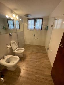 a bathroom with a toilet and a bidet at Ascochinga, Cordoba, Argentina - Estancia de Polo in Ascochinga