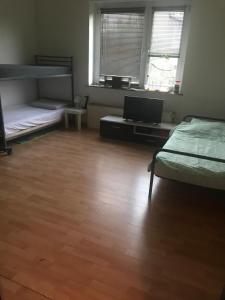 a room with two bunk beds and a laptop computer at MonteurRoomMR in Essen