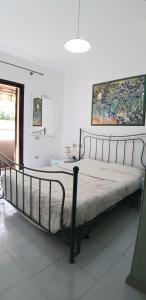 Ένα ή περισσότερα κρεβάτια σε δωμάτιο στο Casa Pillo Nereidi - 30 m dal mare e con vista mare