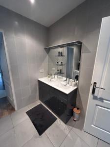 a bathroom with a sink and a mirror at Le Joyau de Gournay - Proche Paris & Disneyland in Gournay-sur-Marne +45 photos