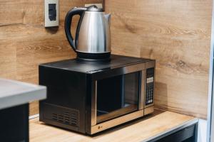 Comodidades para preparar café e chá em Mod Hotels Mendoza