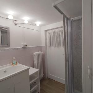 a white bathroom with a sink and a mirror at La Casetta Di Cotignola in Cotignola +24 photos